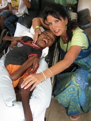 Patricia with a child in need.